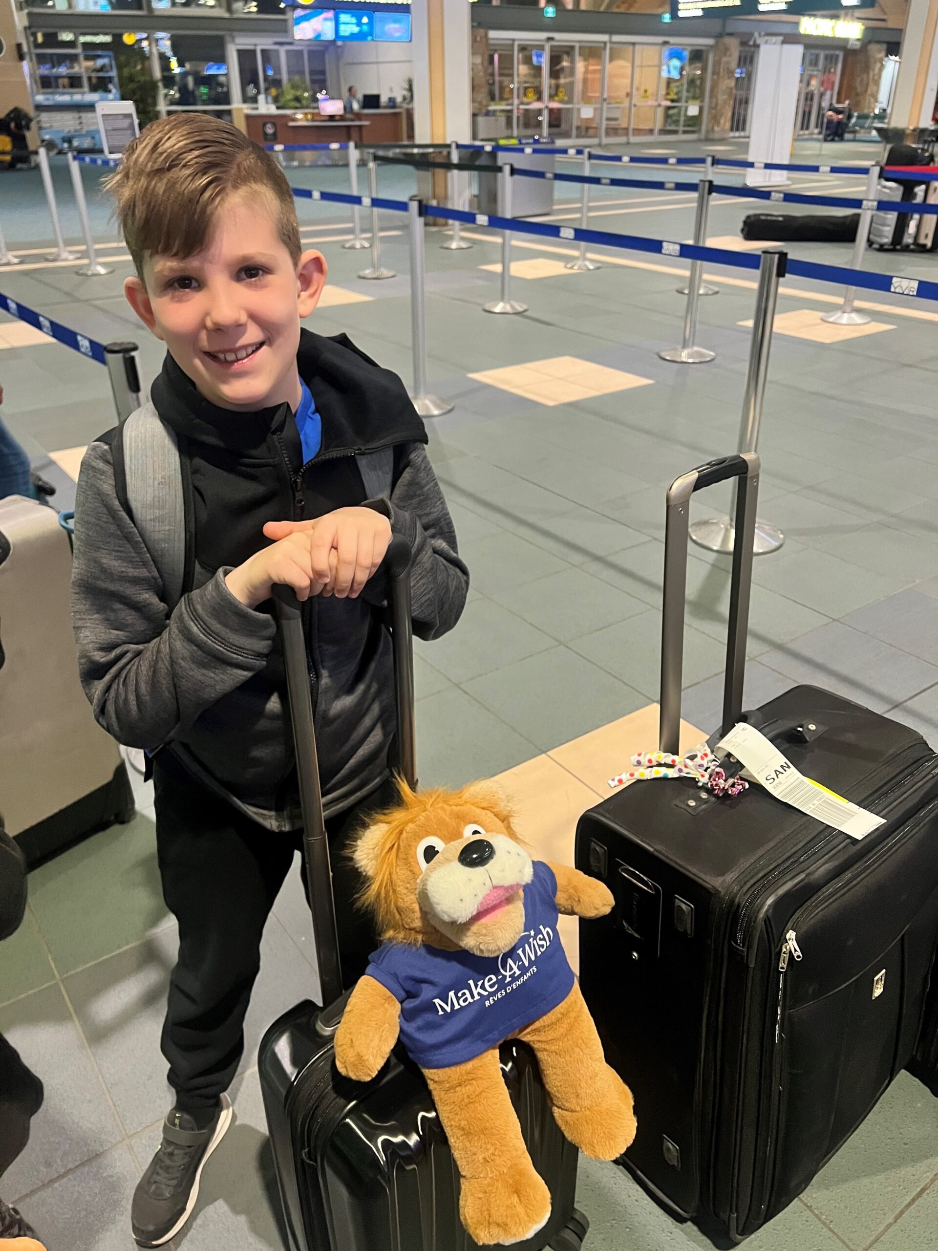 Wish kid Luke ready at the airport